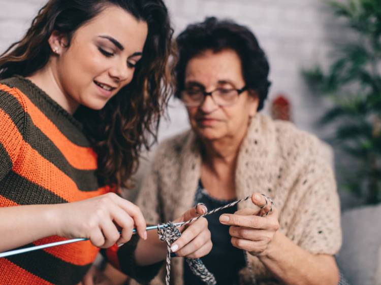 Grandmother with granddaughter getting ready to knit