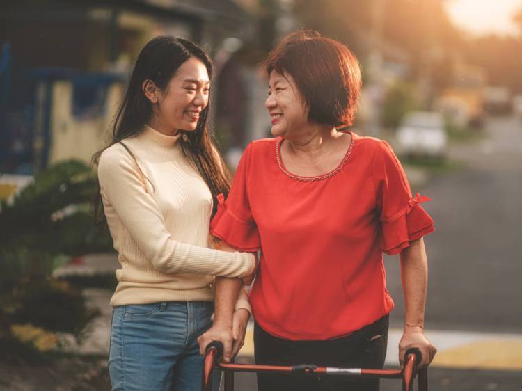 Woman helping senior